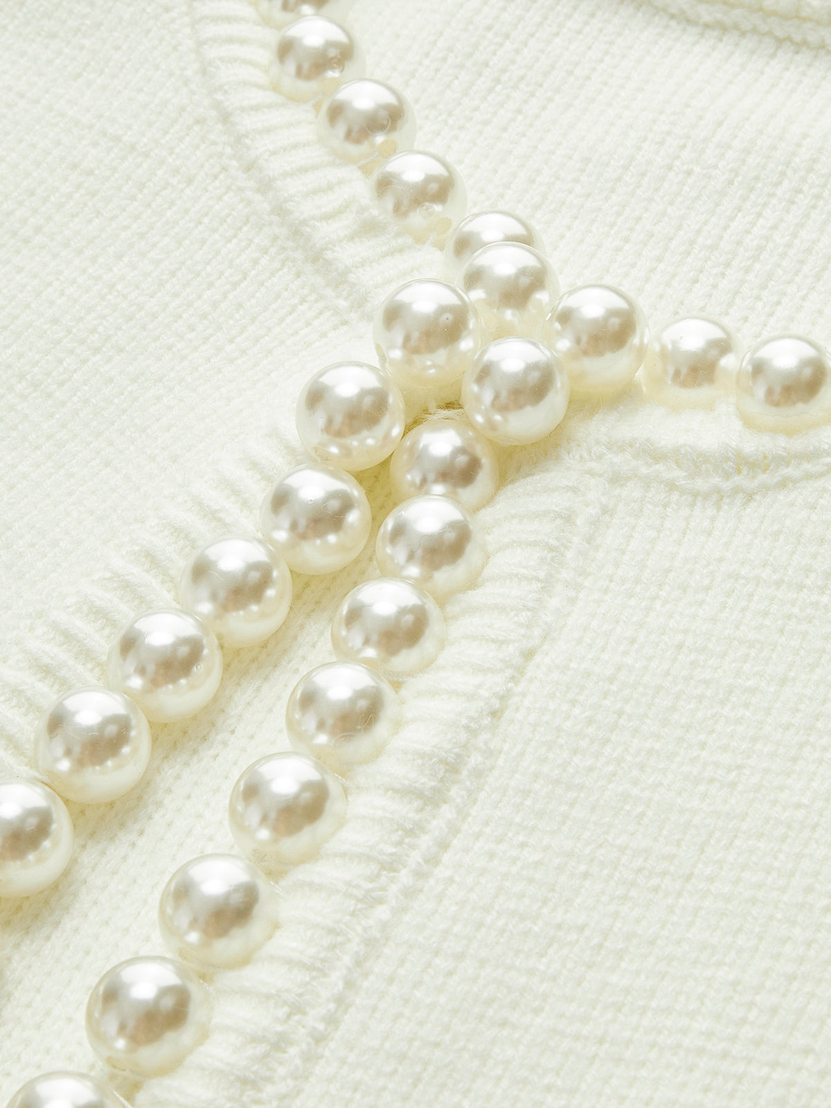 Cardigan elegante Amaraine adornato di perle