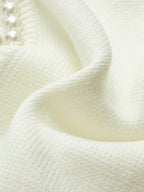Cardigan elegante Amaraine adornato di perle