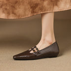 Etta | Mules a doppia fascia con brogue